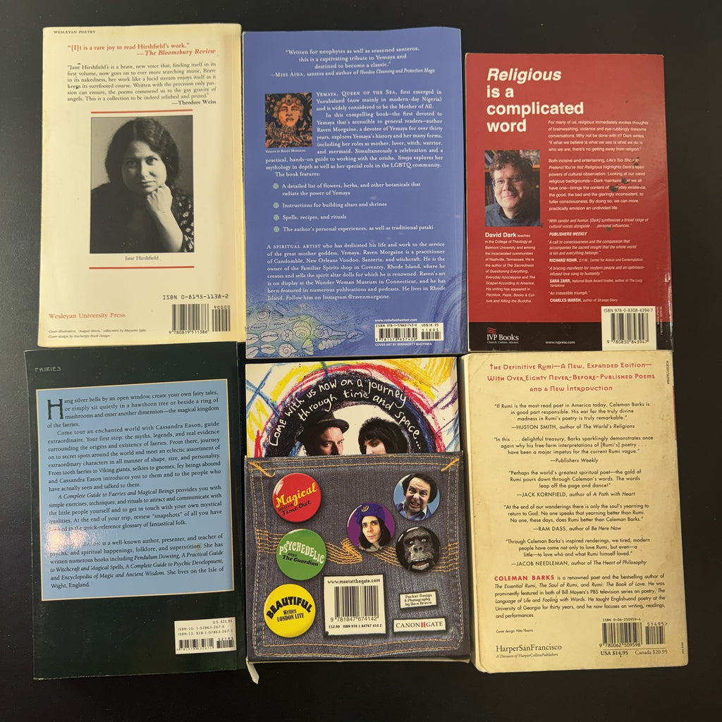 Set of 6 paperback books on spirituality, folklore, and poetry including The Essential Rumi and Yemaya.