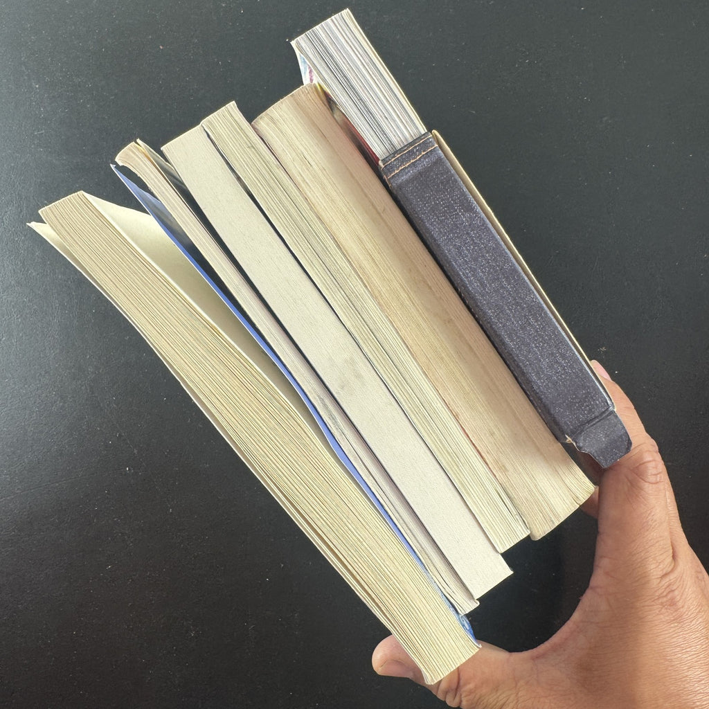 Set of 6 paperback books on spirituality, folklore, and poetry including The Essential Rumi and Yemaya.