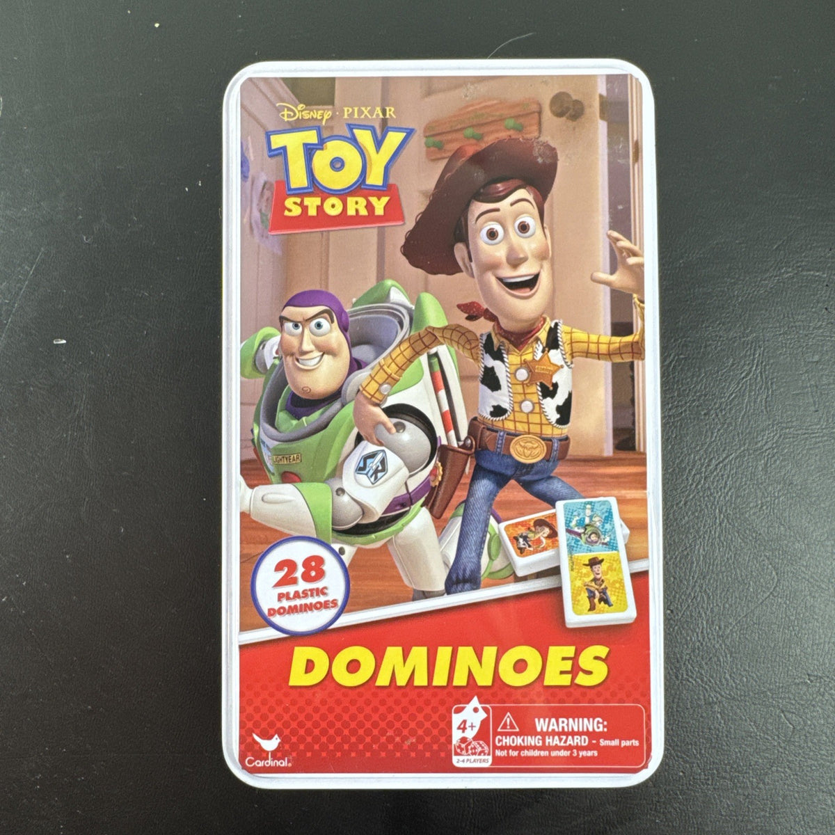 Complete 2006 Disney Pixar Toy Story dominoes game set featuring movie characters.