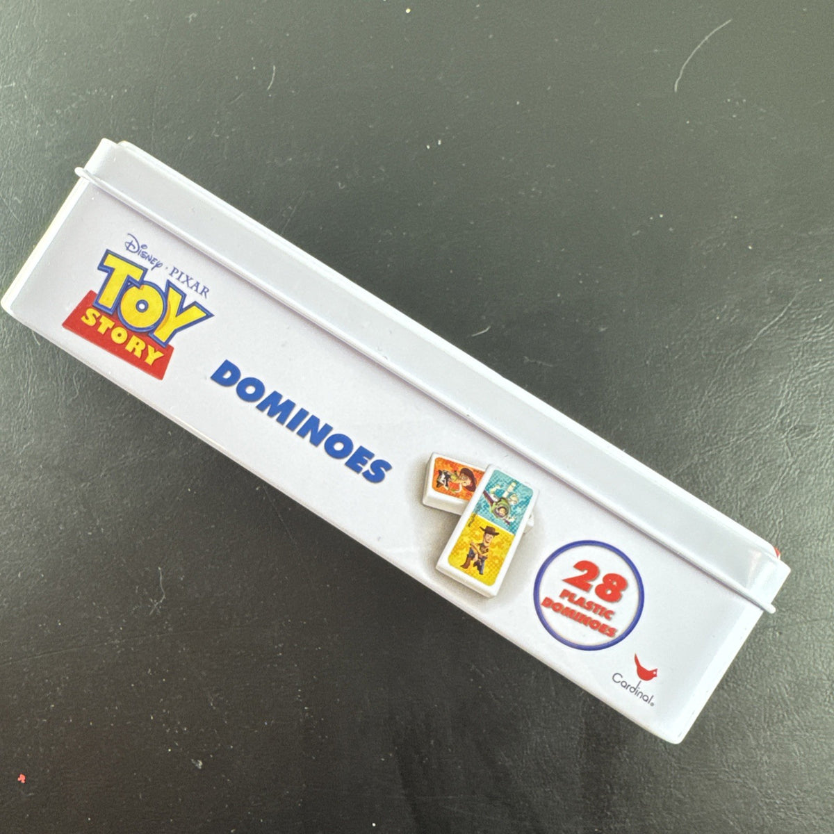 Complete 2006 Disney Pixar Toy Story dominoes game set featuring movie characters.