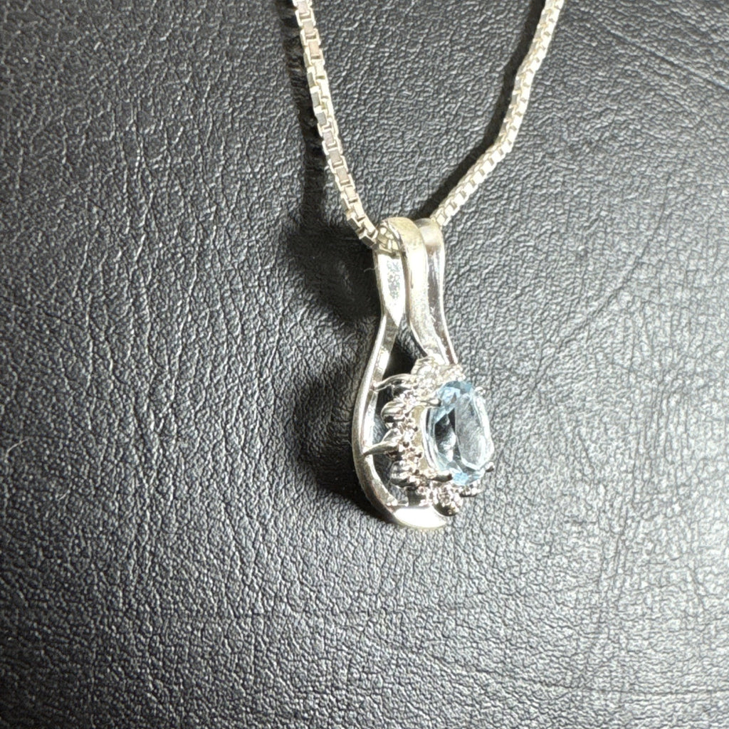 Solid 925 sterling silver teardrop swirl pendant with a light blue oval stone on an Italian box chain.