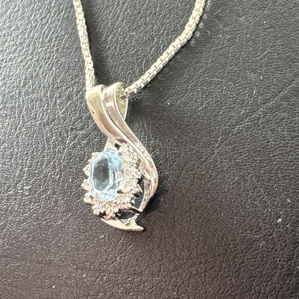 Solid 925 sterling silver teardrop swirl pendant with a light blue oval stone on an Italian box chain.