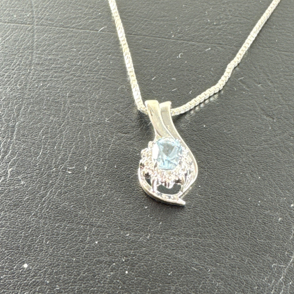 Solid 925 sterling silver teardrop swirl pendant with a light blue oval stone on an Italian box chain.