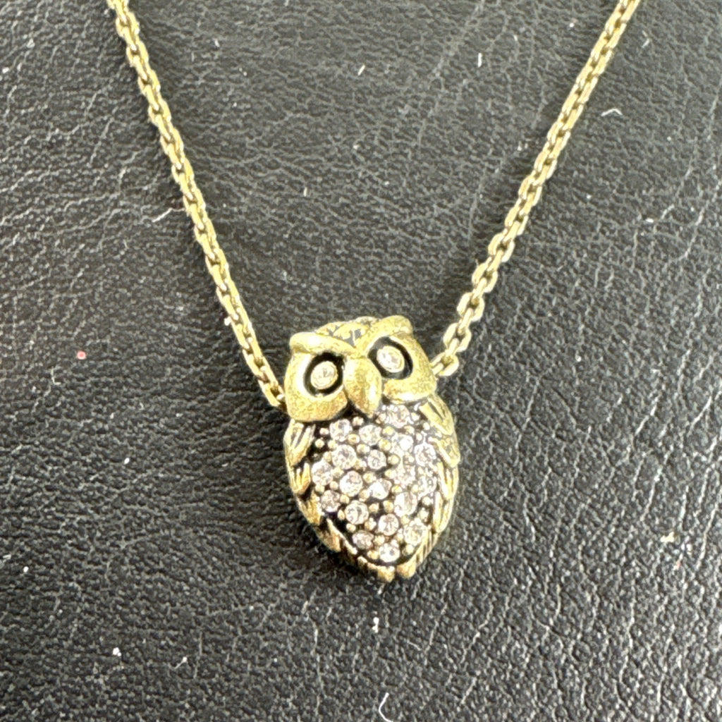 Fossil owl pendant necklace featuring a clear pavé rhinestone belly and signature mini key charm on a display card.