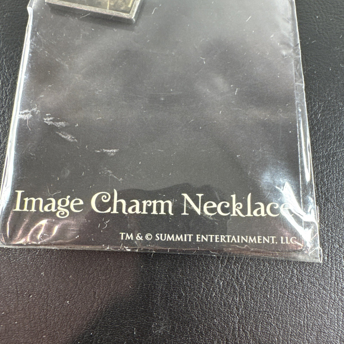 NECA Twilight Edward Cullen silver-tone alloy charm necklace, brand new with tags.
