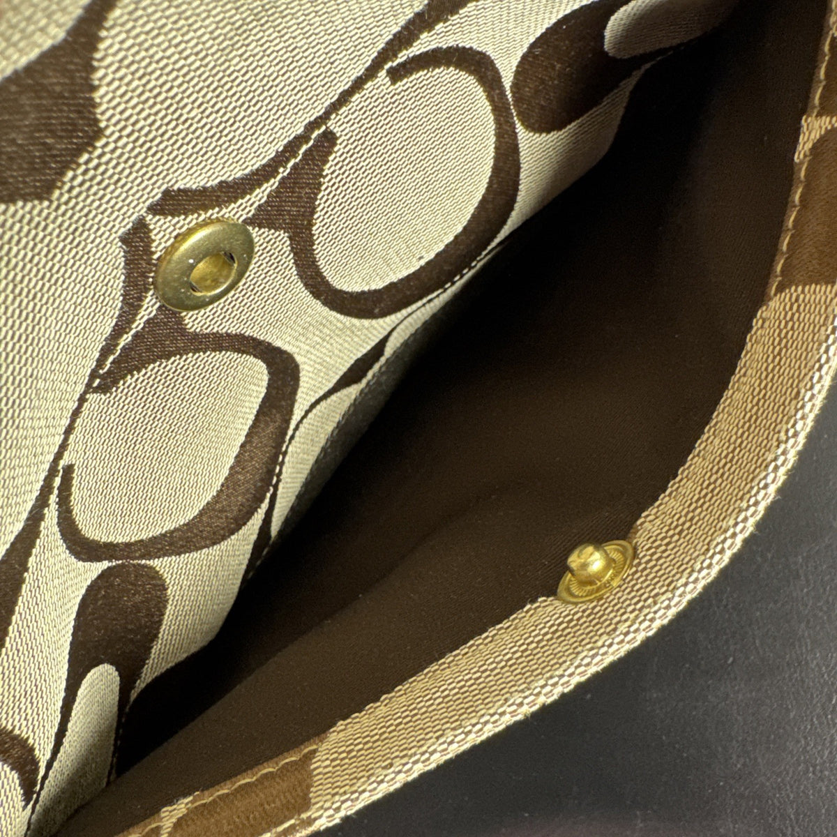 Coach khaki and brown signature jacquard canvas file crossbody bag with leather trim and gold-tone hardware.