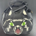 Loungefly Disney Hocus Pocus Thackery Binx black faux leather tote bag showing die-cut cat ears and green eyes.