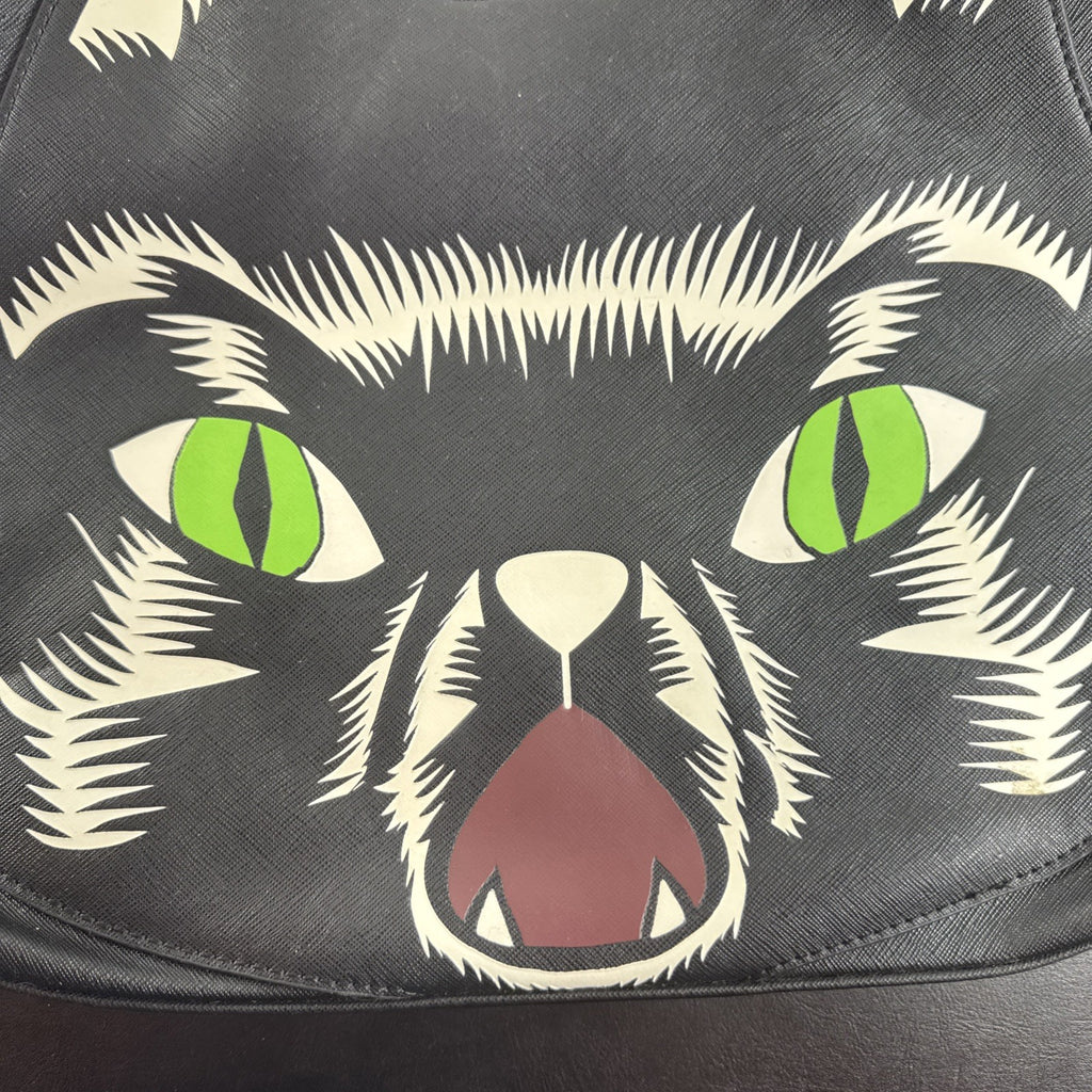 Loungefly Disney Hocus Pocus Thackery Binx black faux leather tote bag showing die-cut cat ears and green eyes.