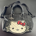 Hello Kitty black faux leather satchel bag with quilted character applique and silver logo charm