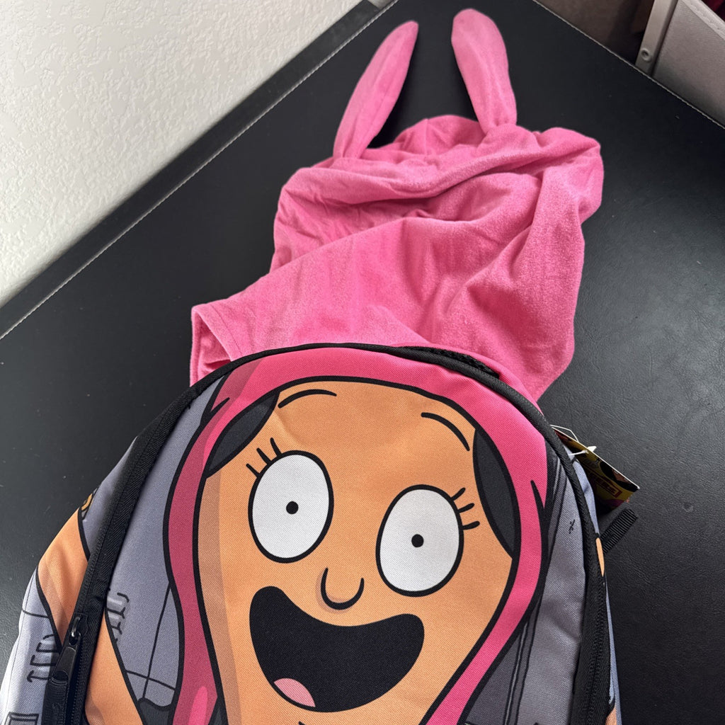 Bob's Burgers Louise Belcher backpack in pink and green featuring a graphic of Louise wearing bunny ears.
