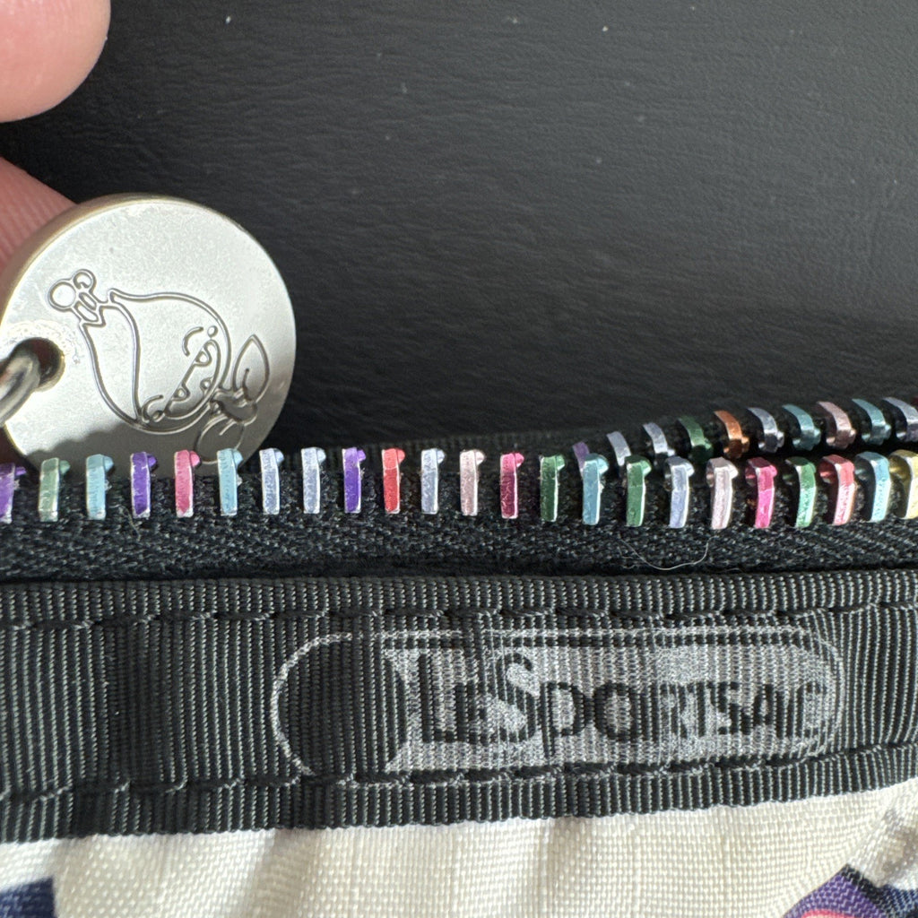 Tokidoki x LeSportsac Vacanze winter print crossbody messenger bag featuring colorful characters and front pockets