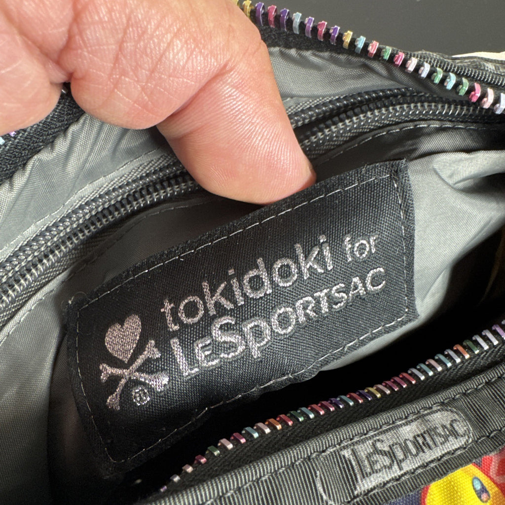 Tokidoki x LeSportsac Vacanze winter print crossbody messenger bag featuring colorful characters and front pockets