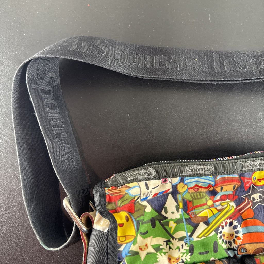 Tokidoki x LeSportsac Vacanze winter print crossbody messenger bag featuring colorful characters and front pockets