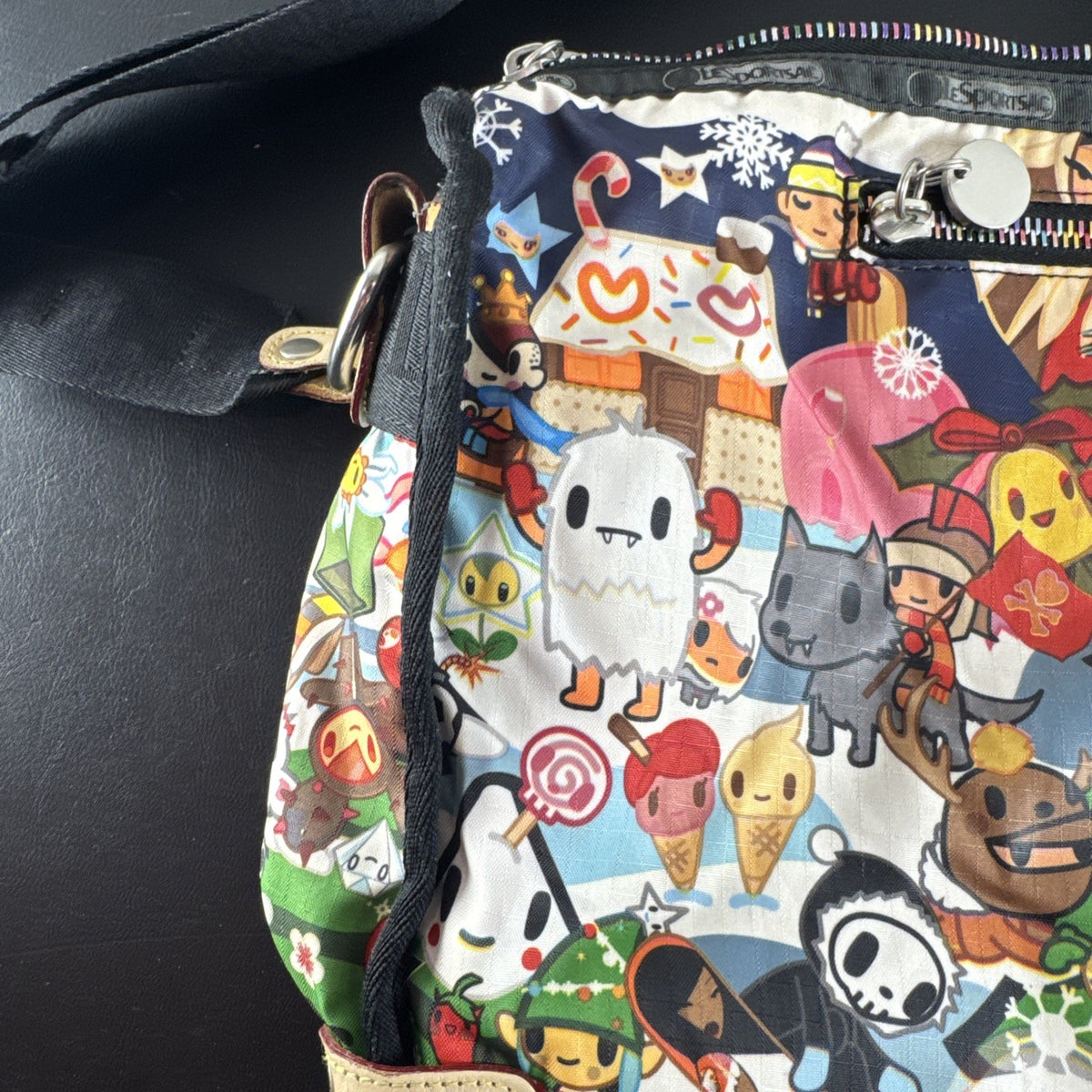 Tokidoki x LeSportsac Vacanze winter print crossbody messenger bag featuring colorful characters and front pockets