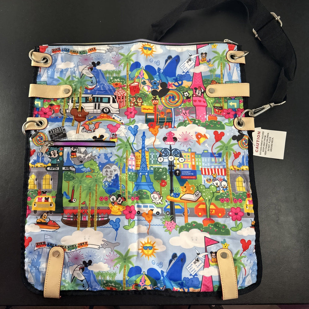 NWT Disney Parks convertible foldover crossbody tote bag in blue park map print with rainbow zipper front pocket.