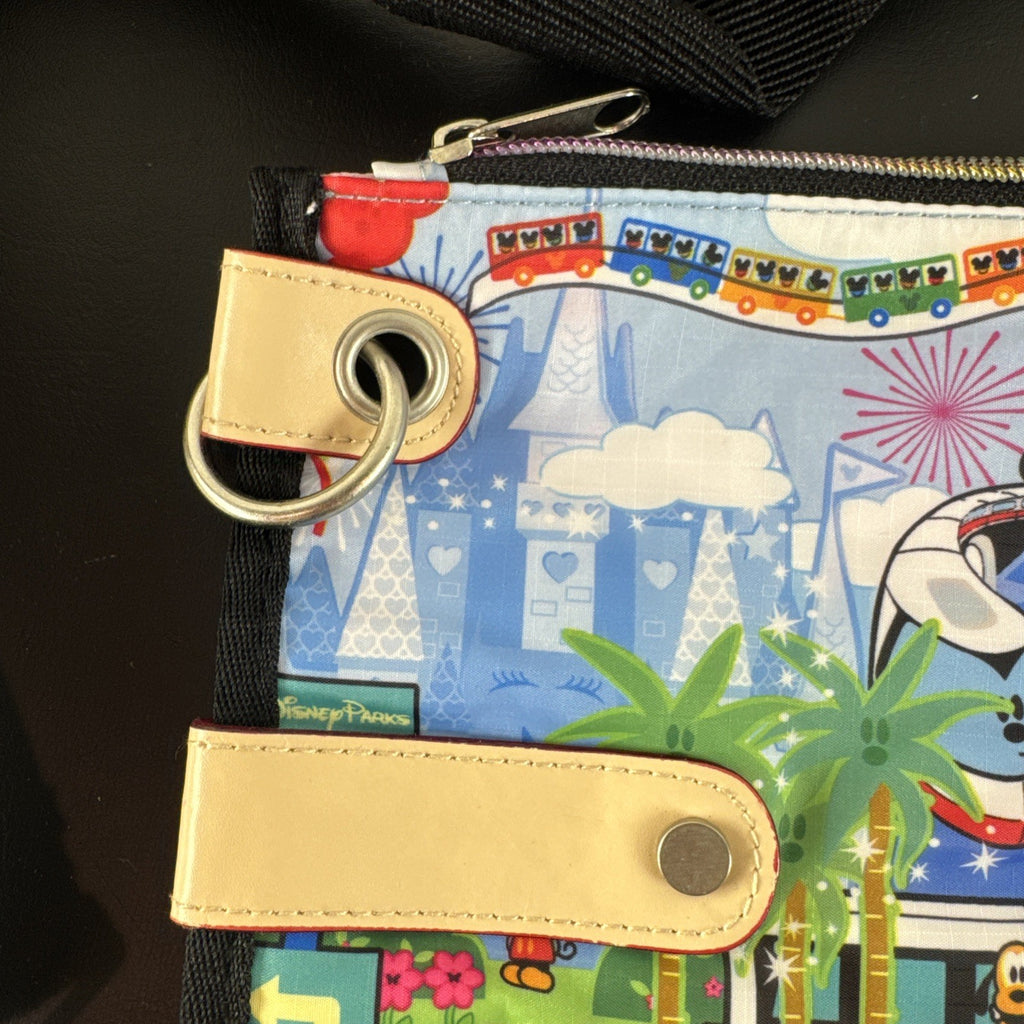NWT Disney Parks convertible foldover crossbody tote bag in blue park map print with rainbow zipper front pocket.