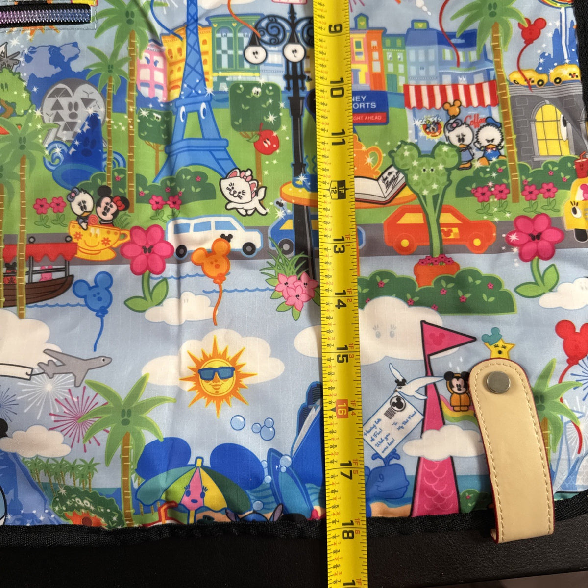 NWT Disney Parks convertible foldover crossbody tote bag in blue park map print with rainbow zipper front pocket.