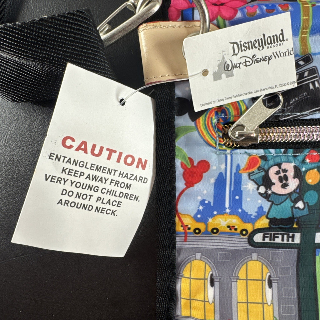 NWT Disney Parks convertible foldover crossbody tote bag in blue park map print with rainbow zipper front pocket.