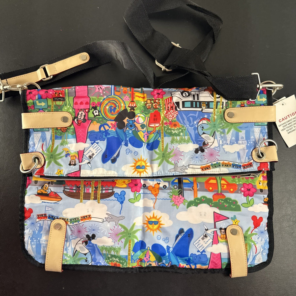 NWT Disney Parks convertible foldover crossbody tote bag in blue park map print with rainbow zipper front pocket.