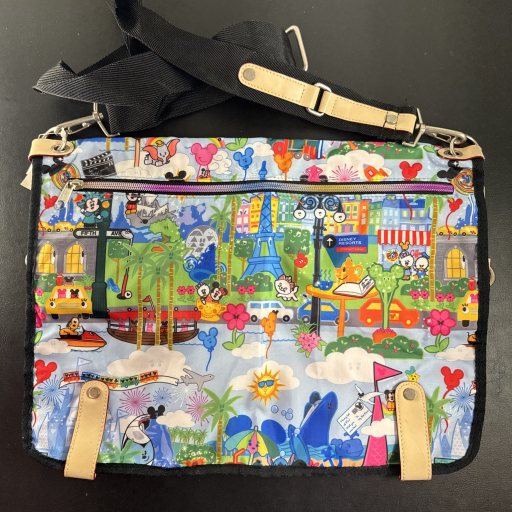 NWT Disney Parks convertible foldover crossbody tote bag in blue park map print with rainbow zipper front pocket.