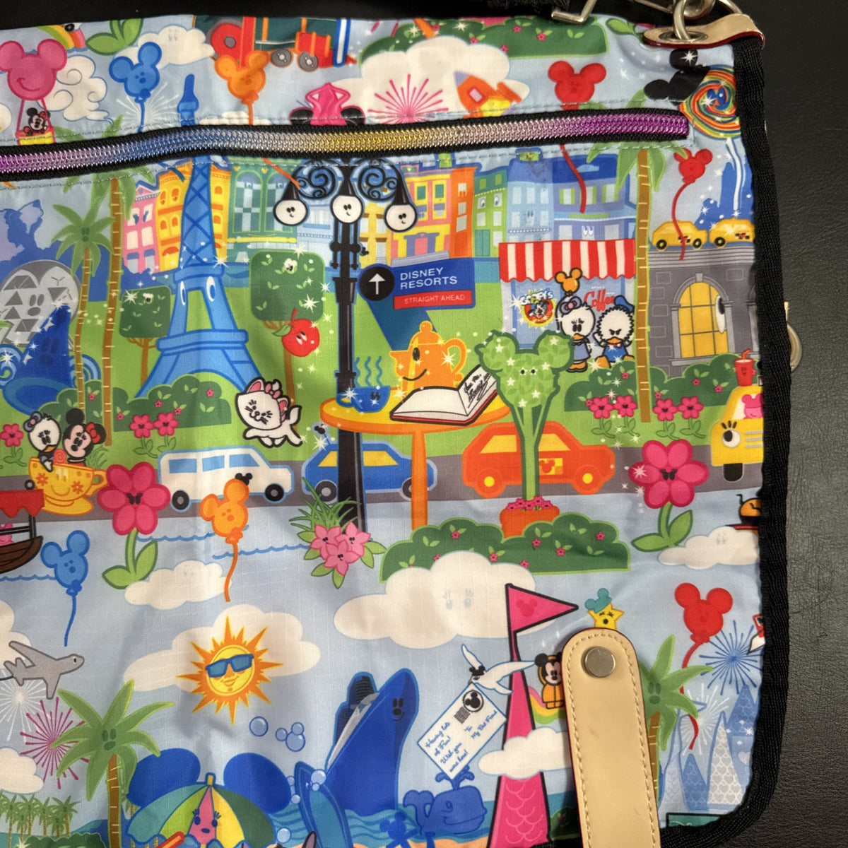 NWT Disney Parks convertible foldover crossbody tote bag in blue park map print with rainbow zipper front pocket.