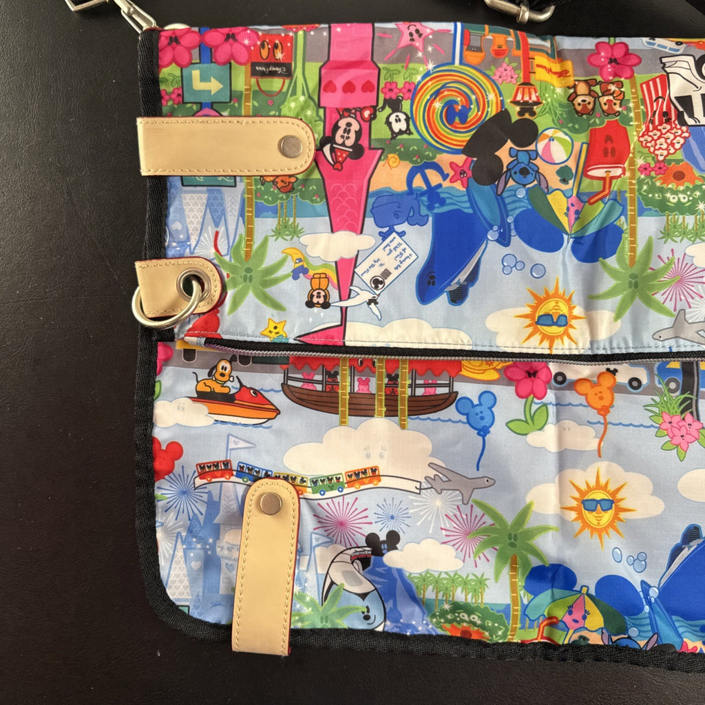 NWT Disney Parks convertible foldover crossbody tote bag in blue park map print with rainbow zipper front pocket.