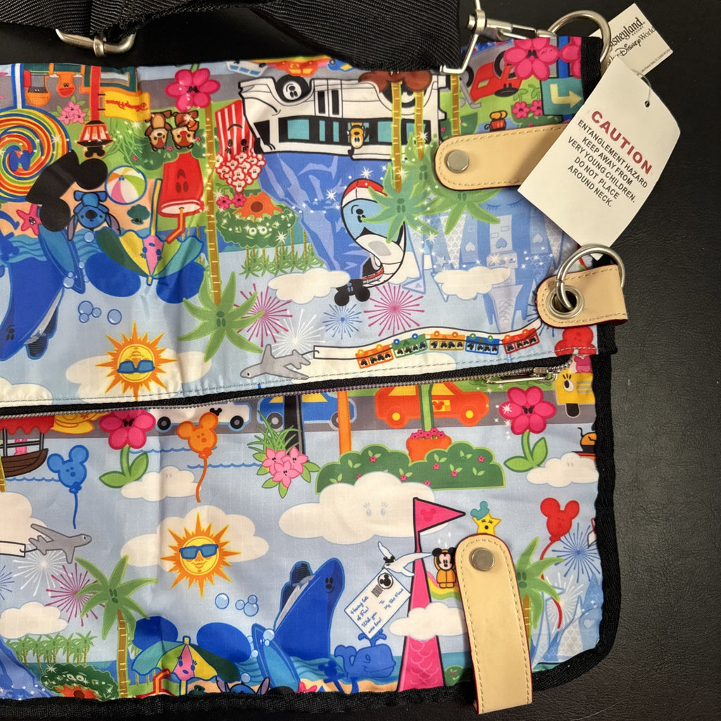 NWT Disney Parks convertible foldover crossbody tote bag in blue park map print with rainbow zipper front pocket.