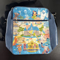 Disney 50th Anniversary retro map blue vinyl messenger bag featuring 1950s park graphics and Mickey ear charm.
