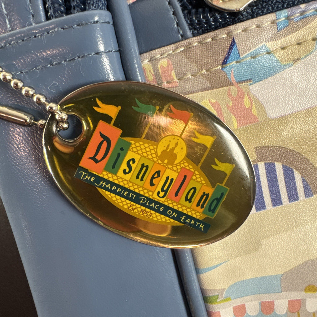 Disney 50th Anniversary retro map blue vinyl messenger bag featuring 1950s park graphics and Mickey ear charm.