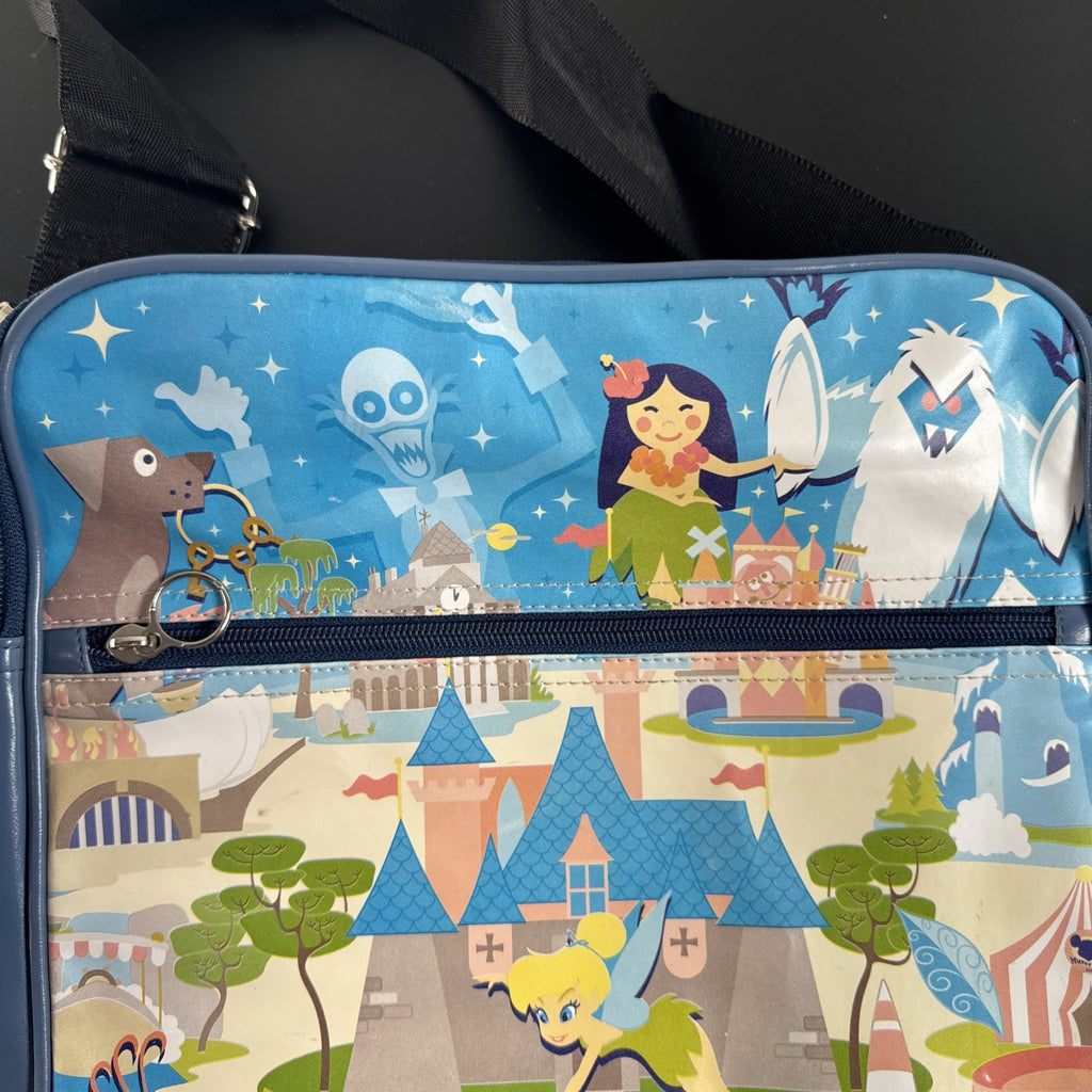 Disney 50th Anniversary retro map blue vinyl messenger bag featuring 1950s park graphics and Mickey ear charm.