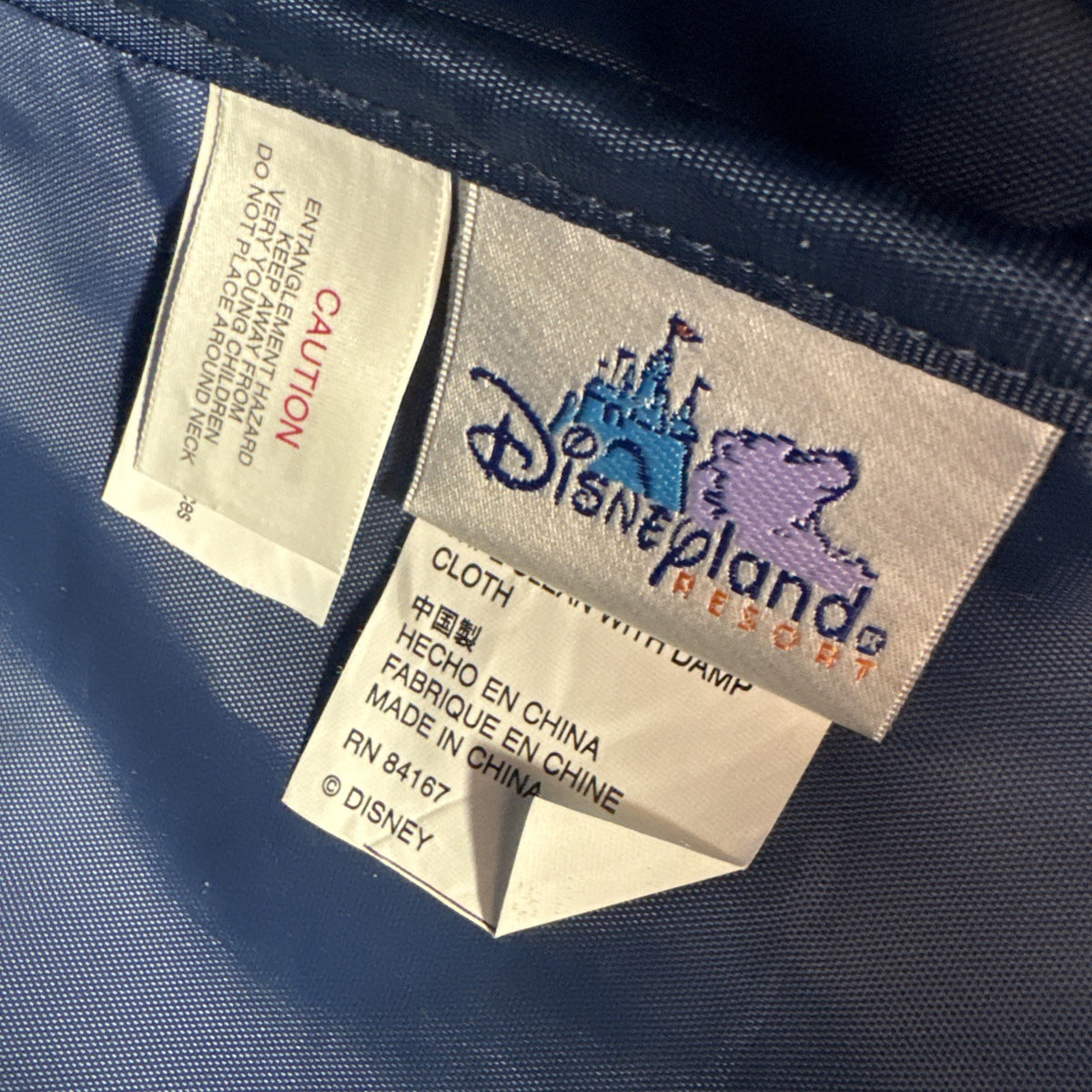 Disney 50th Anniversary retro map blue vinyl messenger bag featuring 1950s park graphics and Mickey ear charm.