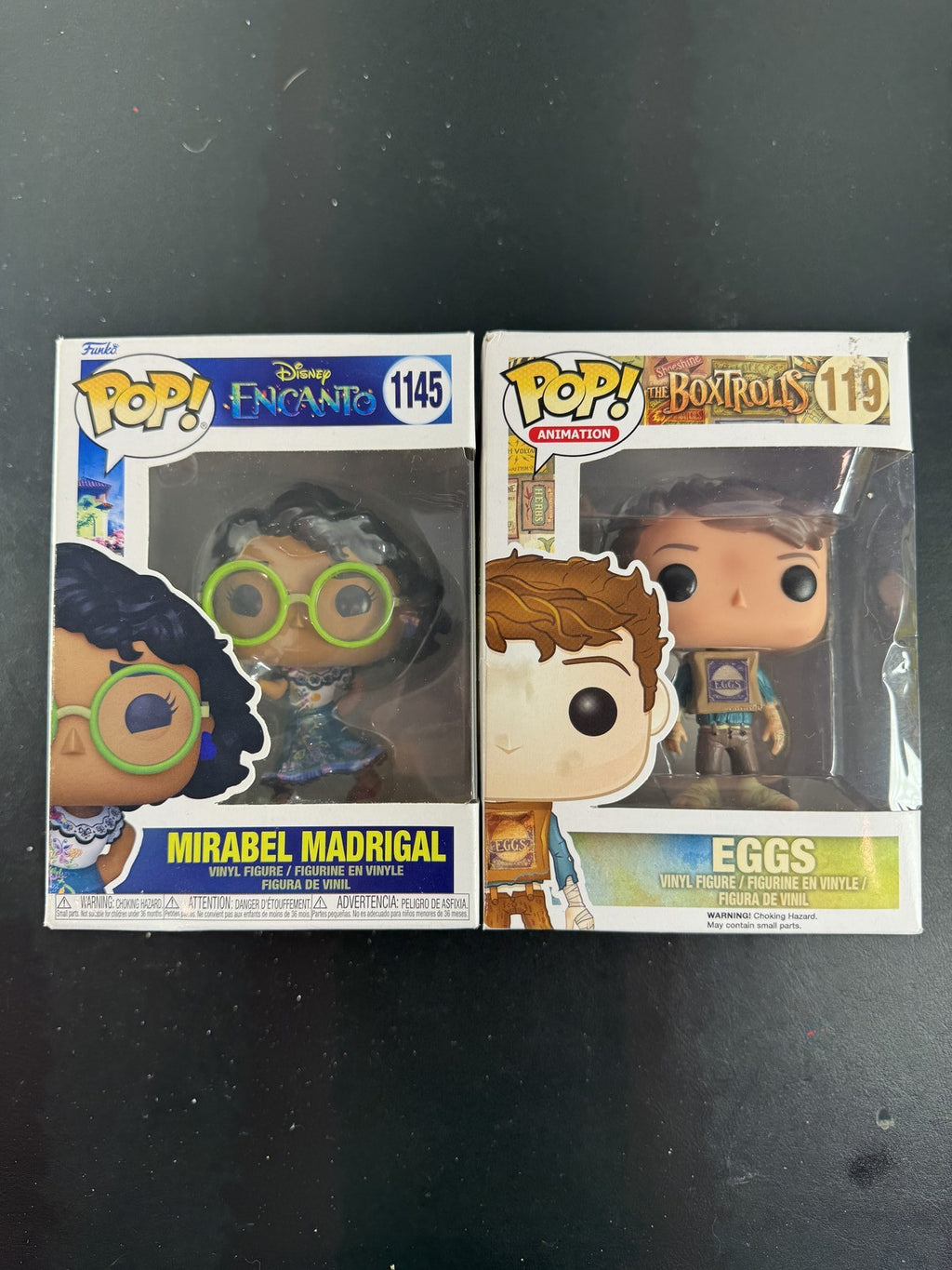 Funko Pop 2-pack set featuring Disney Encanto Mirabel #1145 and Laika The Boxtrolls Eggs #119 vinyl figures in boxes.