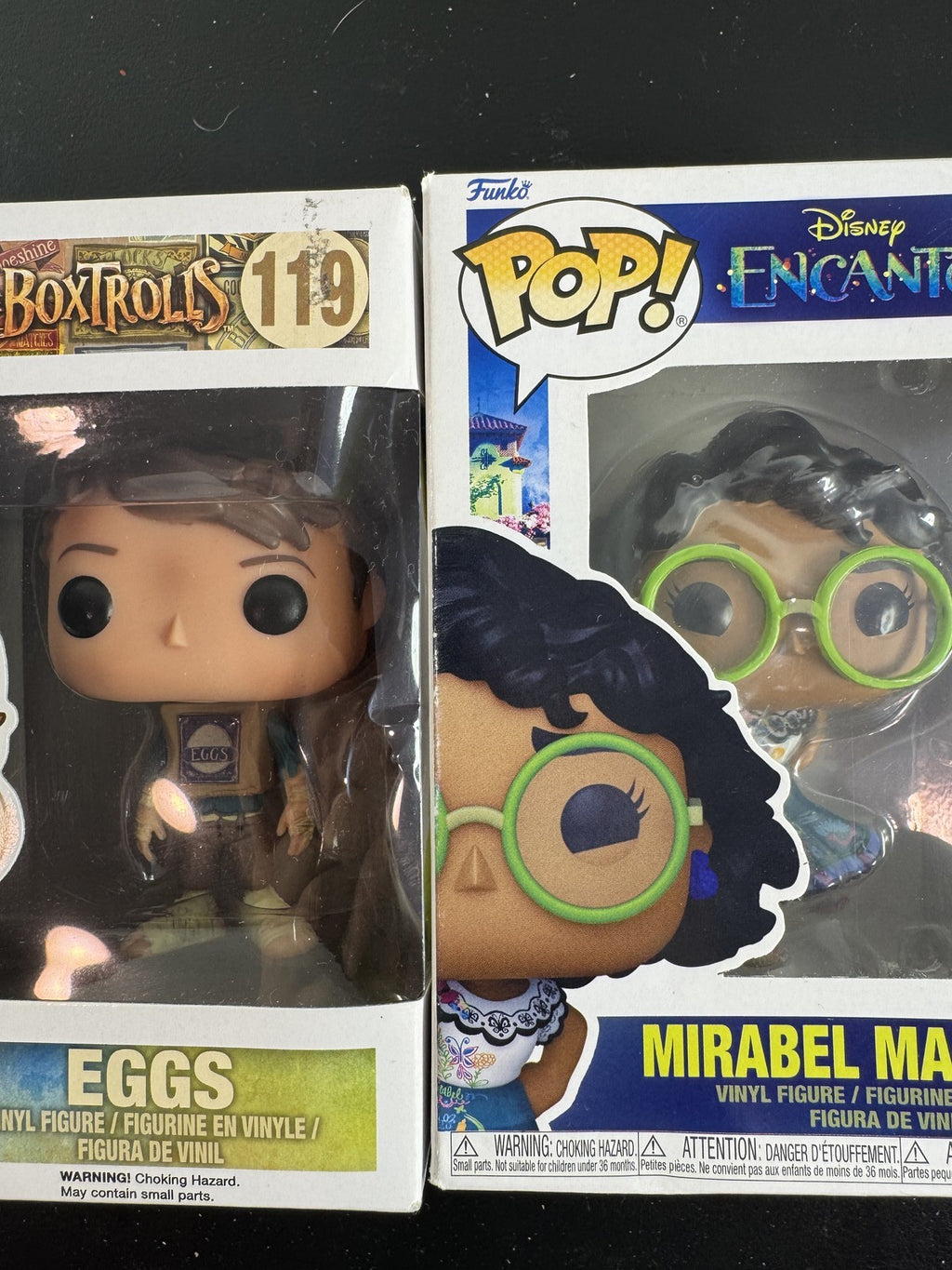 Funko Pop 2-pack set featuring Disney Encanto Mirabel #1145 and Laika The Boxtrolls Eggs #119 vinyl figures in boxes.