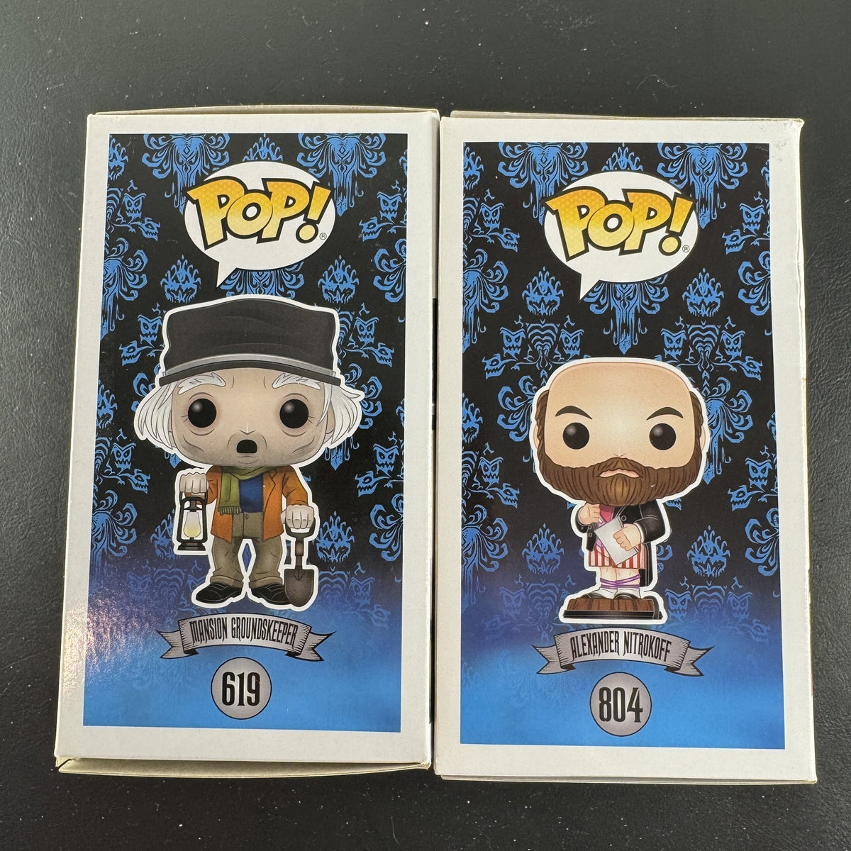 Funko Pop Disney The Haunted Mansion 2-figure set featuring Mansion Groundskeeper 619 and Alexander Nitrokoff 804 in boxes