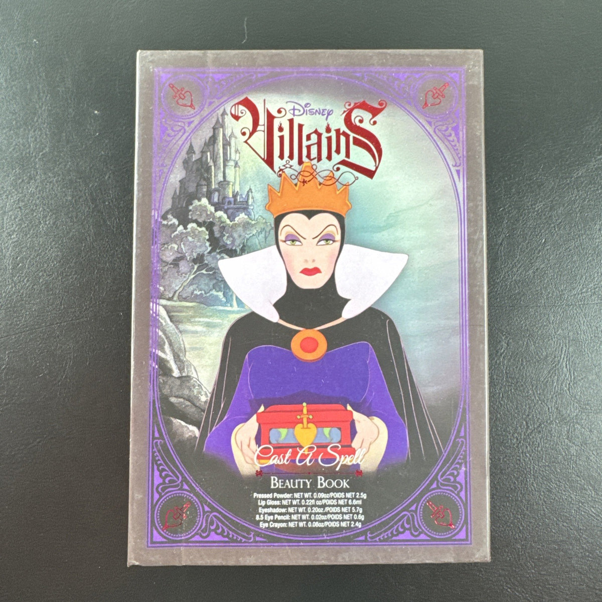 Wet n Wild Disney Villains Evil Queen Cast a Spell Beauty Book makeup set containing eye shadow, eyeliner, and lip gloss.
