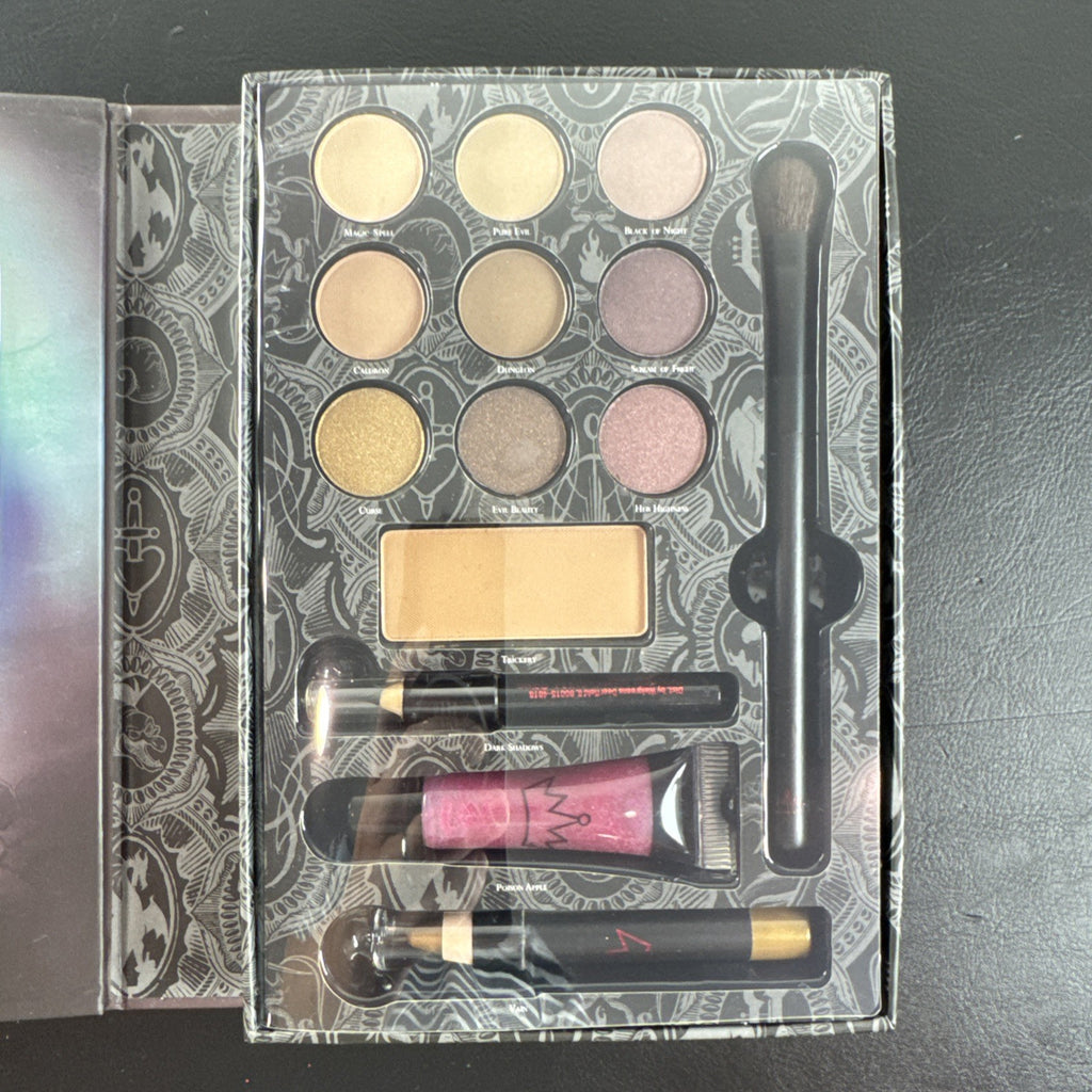 Wet n Wild Disney Villains Evil Queen Cast a Spell Beauty Book makeup set containing eye shadow, eyeliner, and lip gloss.
