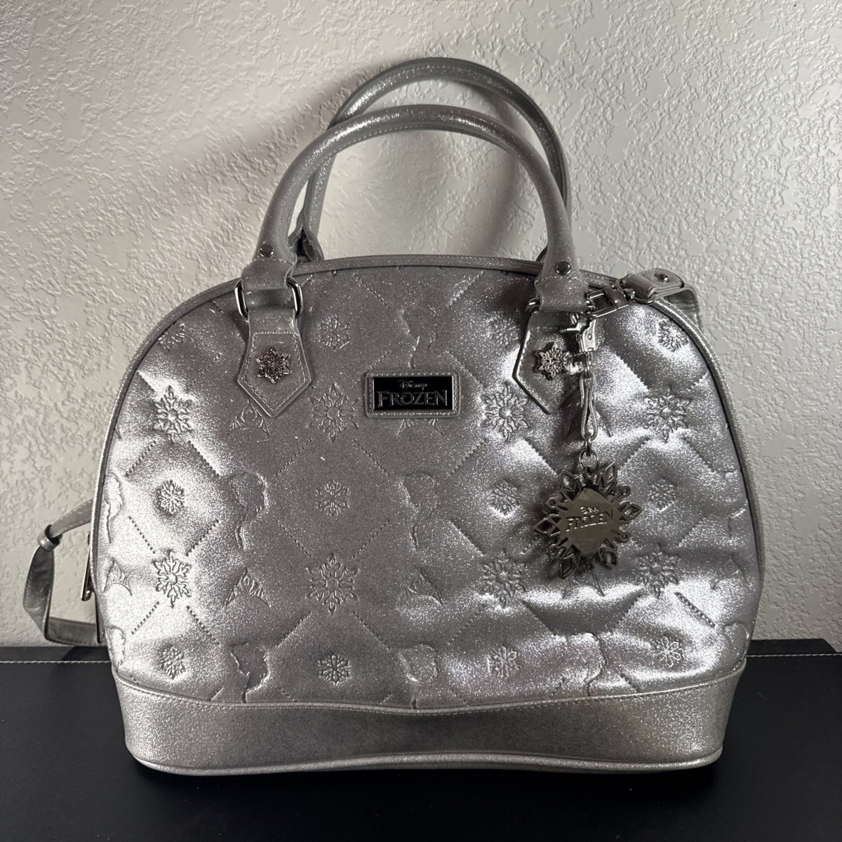 Disney Frozen small silver glitter handbag with a snowflake charm