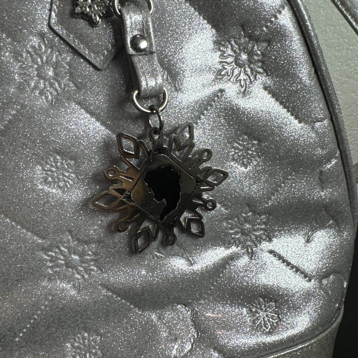 Disney Frozen small silver glitter handbag with a snowflake charm
