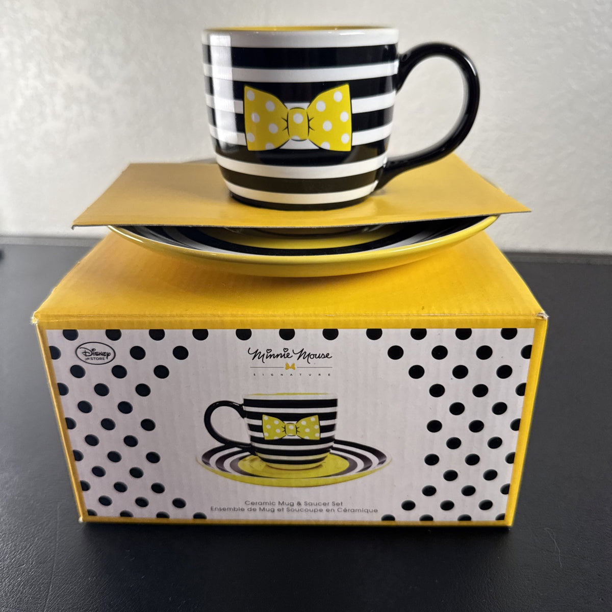 Black ceramic Disney Minnie Mouse Signature mug and matching saucer set in new condition.