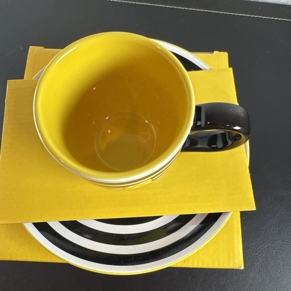 Black ceramic Disney Minnie Mouse Signature mug and matching saucer set in new condition.