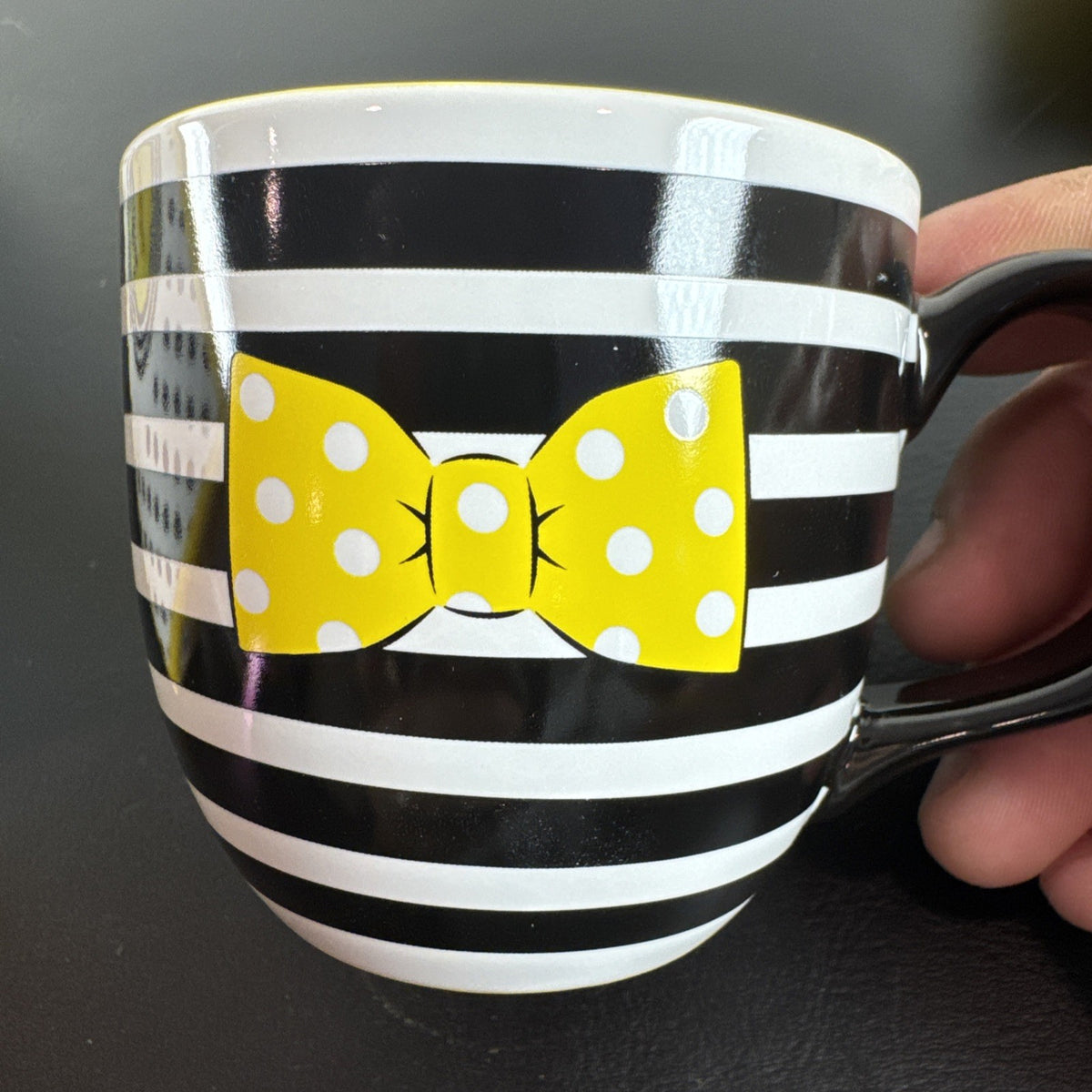 Black ceramic Disney Minnie Mouse Signature mug and matching saucer set in new condition.