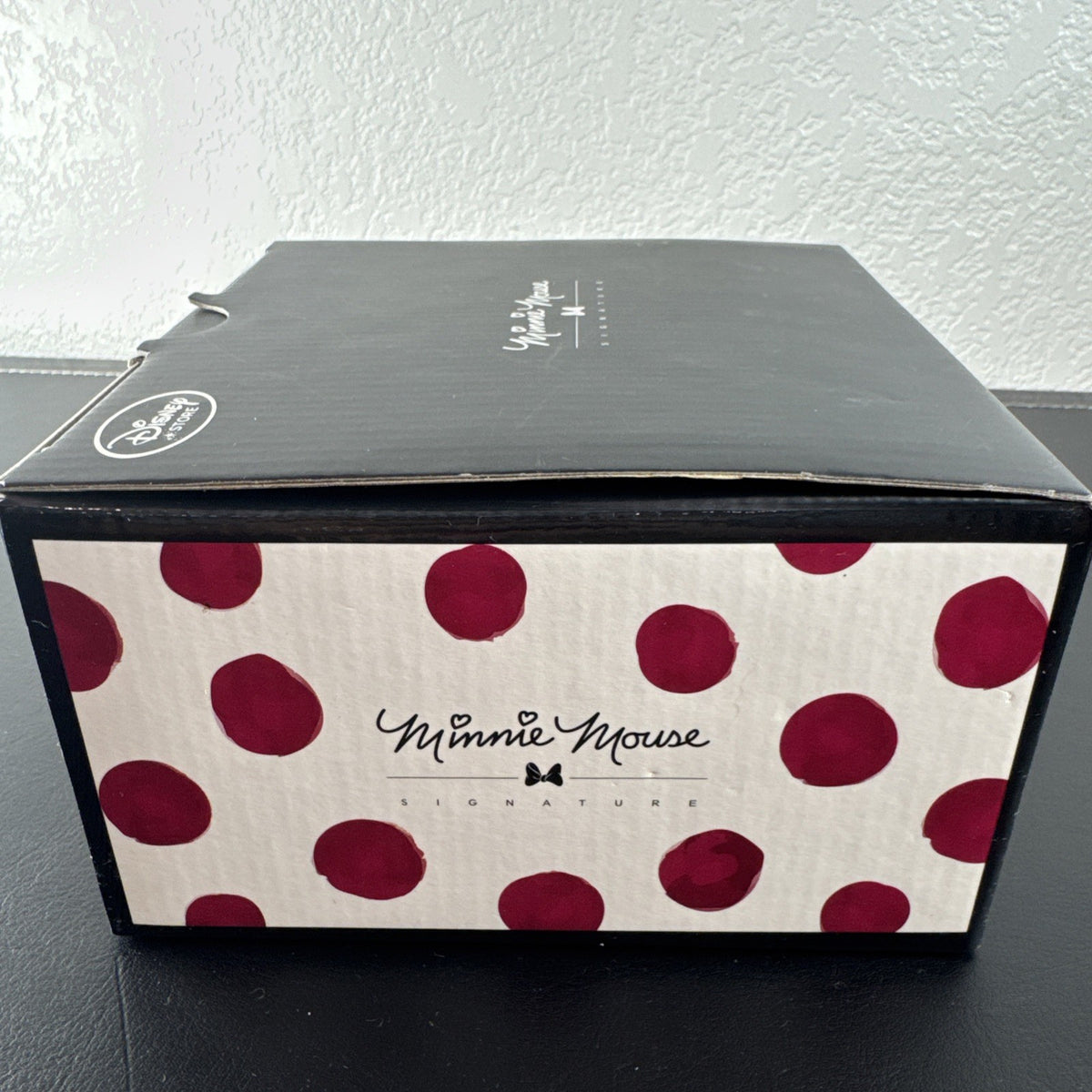 Disney Store Minnie Mouse Signature Collection cup and saucer set with red bow and polka dot design.
