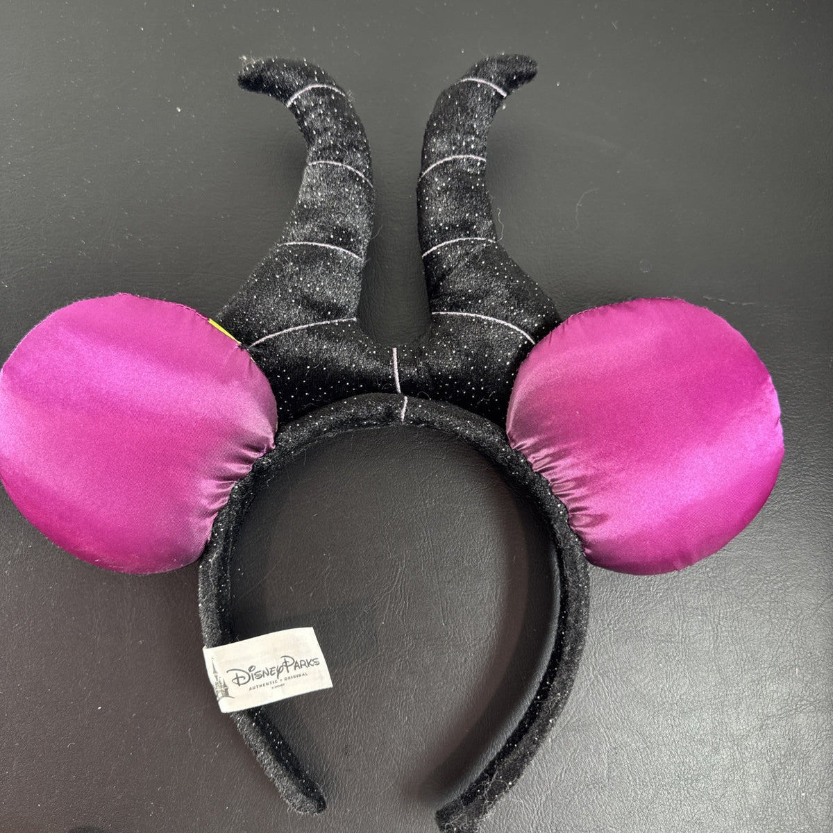 Disney Parks Maleficent Minnie Mouse ear headband featuring black glitter horns.
