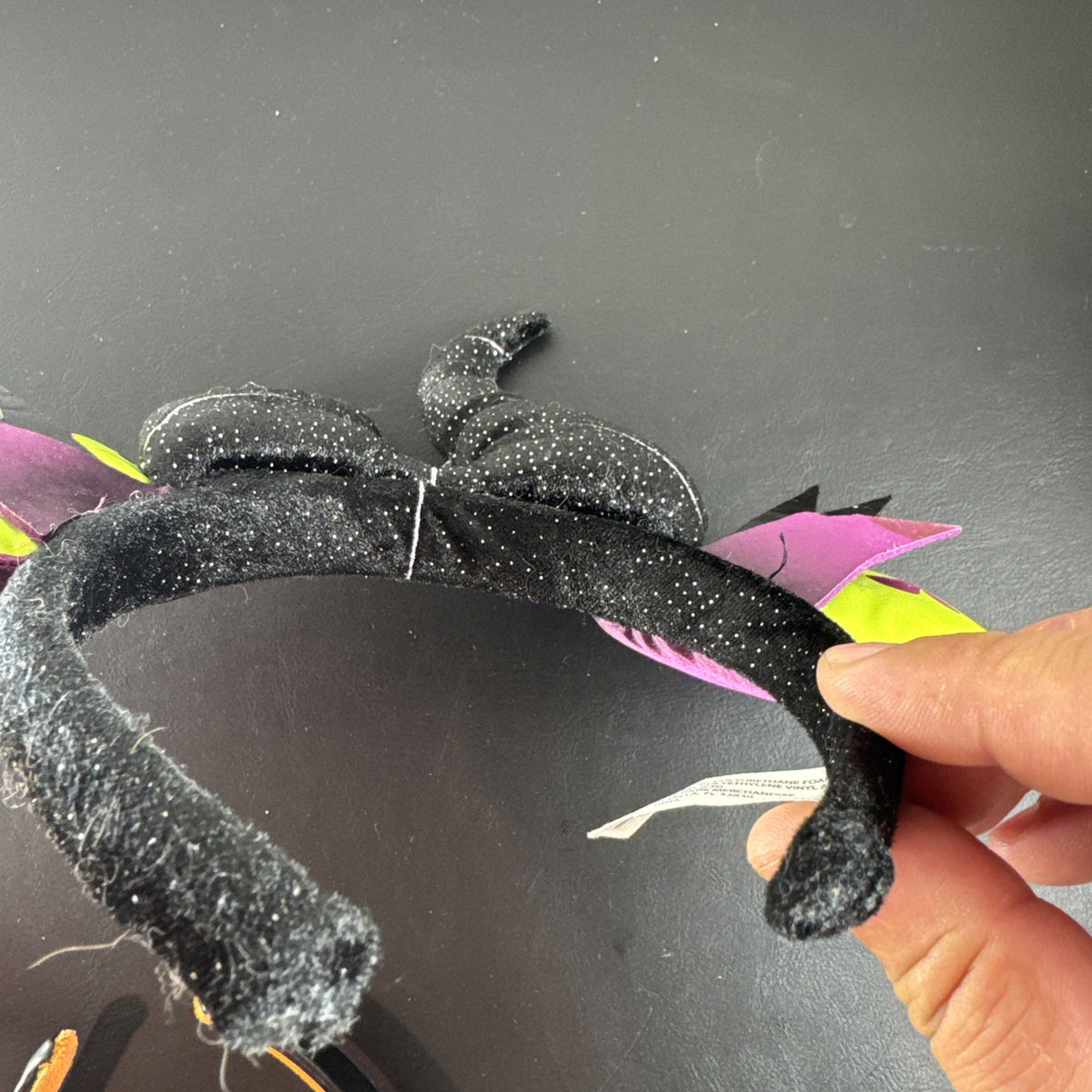 Disney Parks Maleficent Minnie Mouse ear headband featuring black glitter horns.