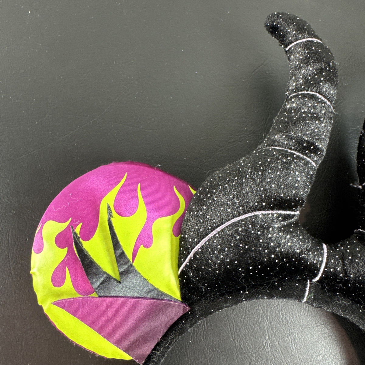 Disney Parks Maleficent Minnie Mouse ear headband featuring black glitter horns.