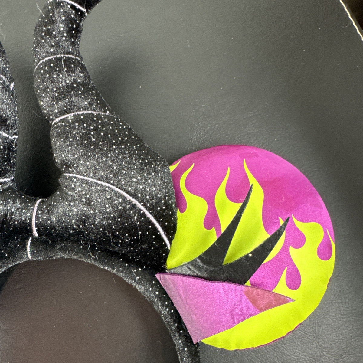 Disney Parks Maleficent Minnie Mouse ear headband featuring black glitter horns.