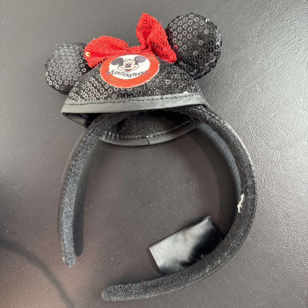 Lot of 3 Disney Parks Minnie Mouse ear headbands including Halloween Witch Hat, Mouseketeer, and Jack Skellington styles.
