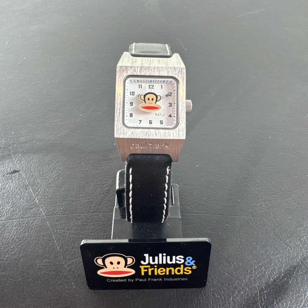 Paul Frank Julius square watch with black dial, stainless steel case, and black leather strap
