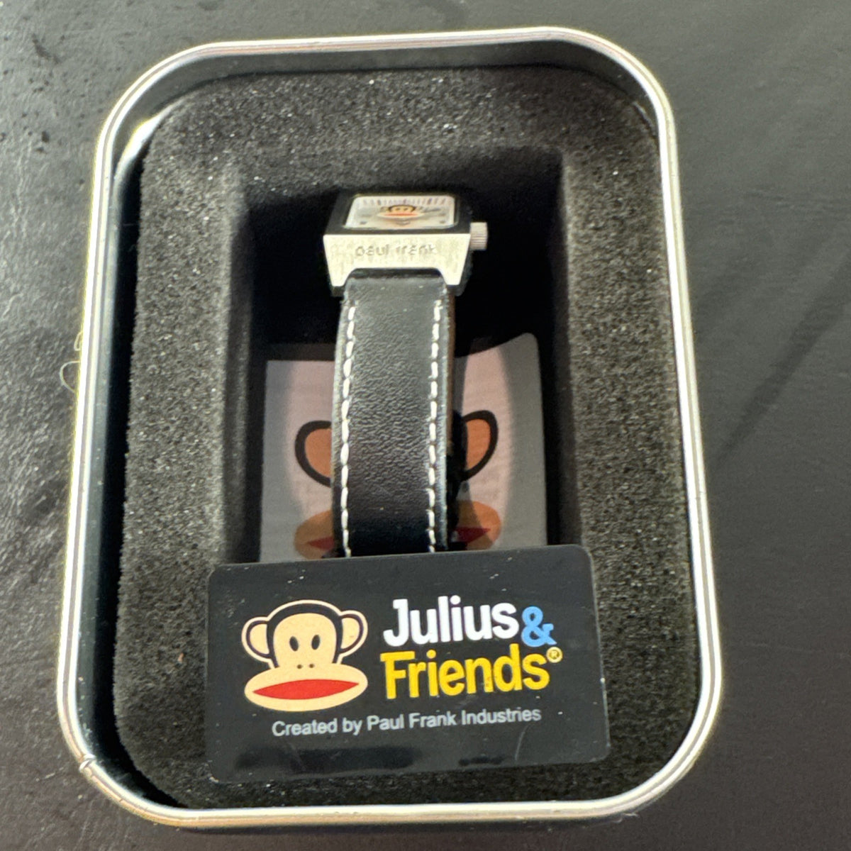 Paul Frank Julius square watch with black dial, stainless steel case, and black leather strap