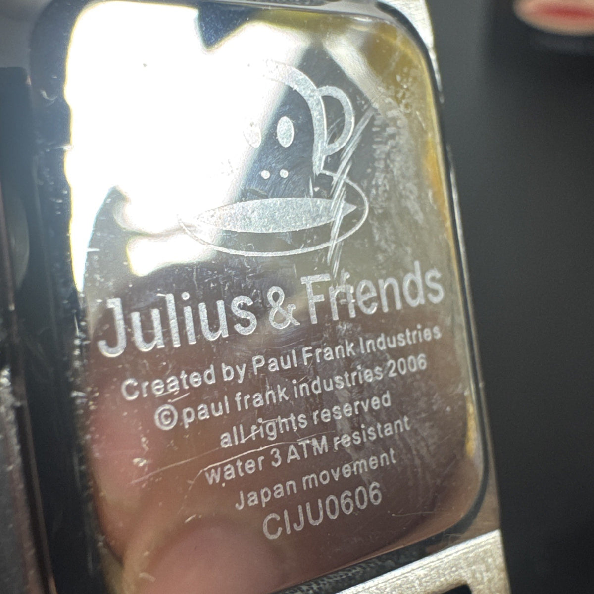 Paul Frank Julius square watch with black dial, stainless steel case, and black leather strap